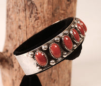 Navajo Sterling Silver Bracelet with Nine Coral Settings by Paul Lawrence