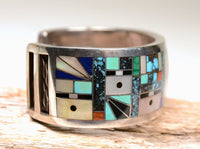 Zuni "Sunface and Yei" Sterling Silver Multistone Inlay Cuff Bracelet by Gilbert Calavaza