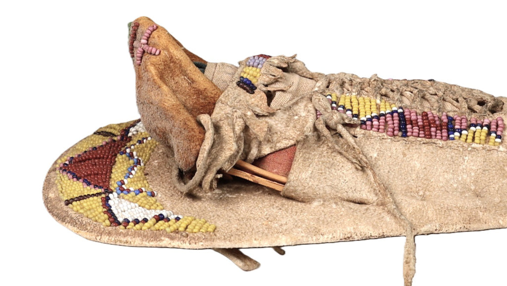 An Early Ute Beaded Toy Cradle Doll