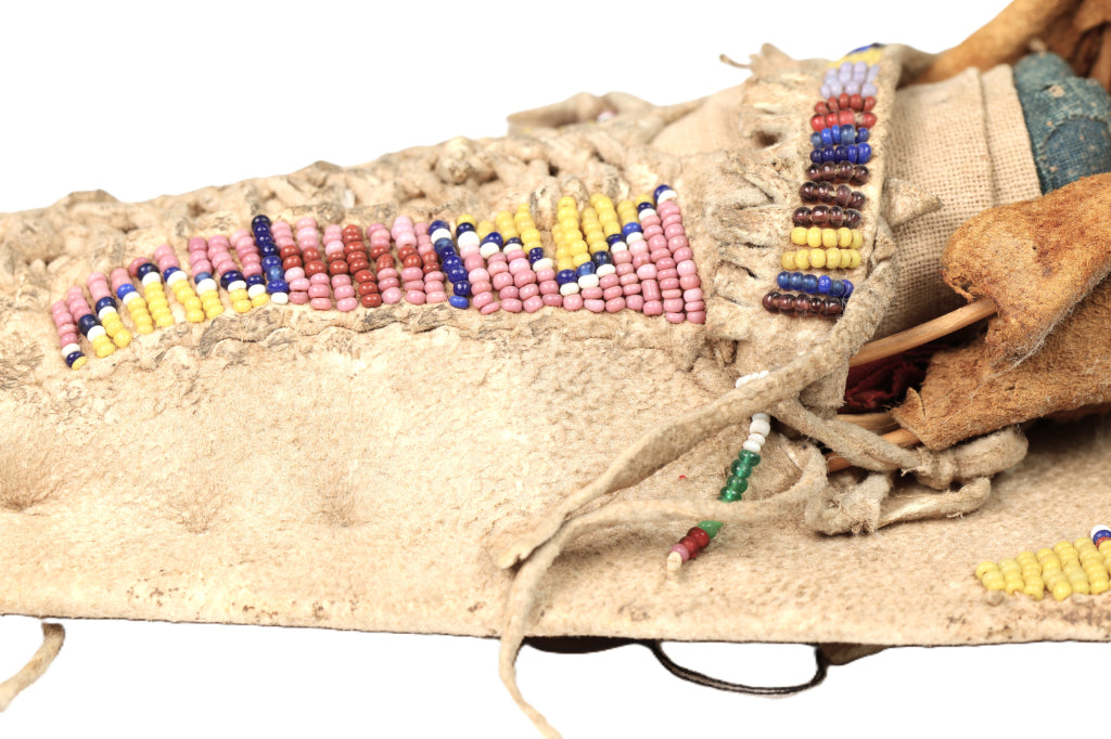 An Early Ute Beaded Toy Cradle Doll