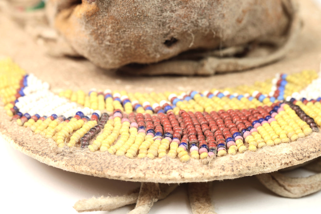 An Early Ute Beaded Toy Cradle Doll