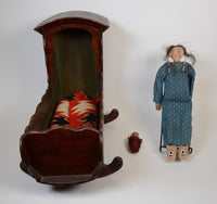 Plains Indian Hide and Cloth Doll in Cradle