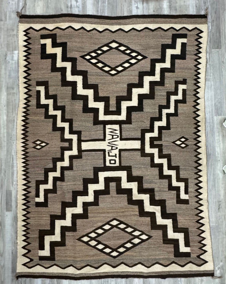Navajo Storm Pattern Natural Crystal Rug with the word "NAVAJO" in Center