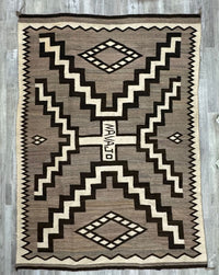 Navajo Storm Pattern Natural Crystal Rug with the word "NAVAJO" in Center