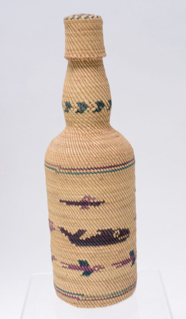 Makah basket covered bottle