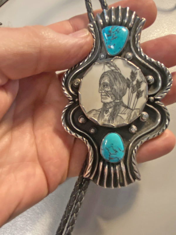 Navajo Bolo Tie with scrimshaw picture of Indian brave with arrows