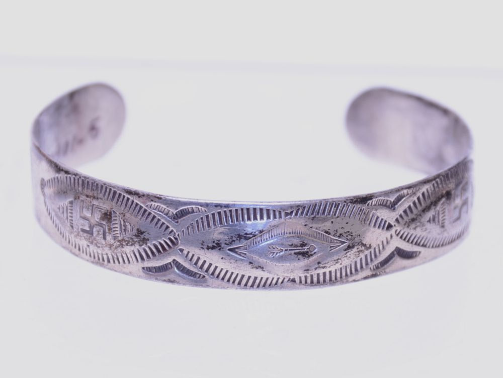 Navajo Fred Harvey Silver Bracelet with shallow repousse work under the three ovals