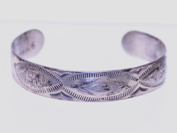 Navajo Fred Harvey Silver Bracelet with shallow repousse work under the three ovals